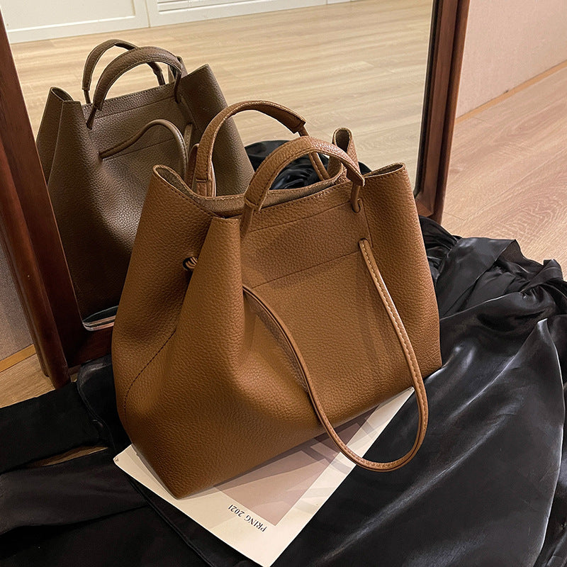 Grote capaciteit damestas, draagbare schoudertas