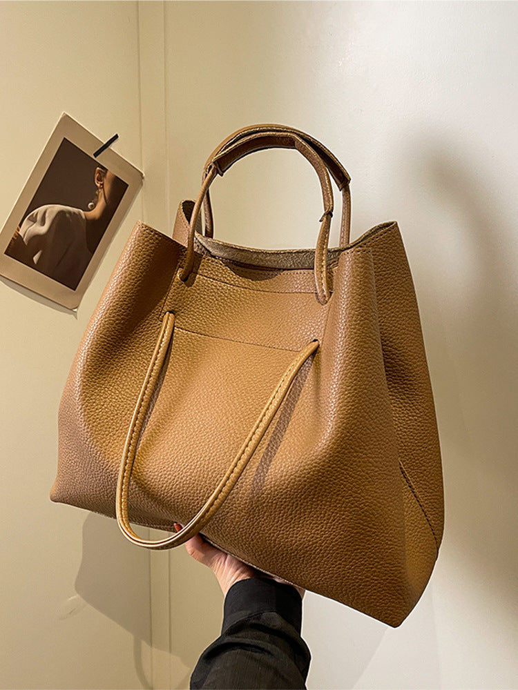 Grote capaciteit damestas, draagbare schoudertas